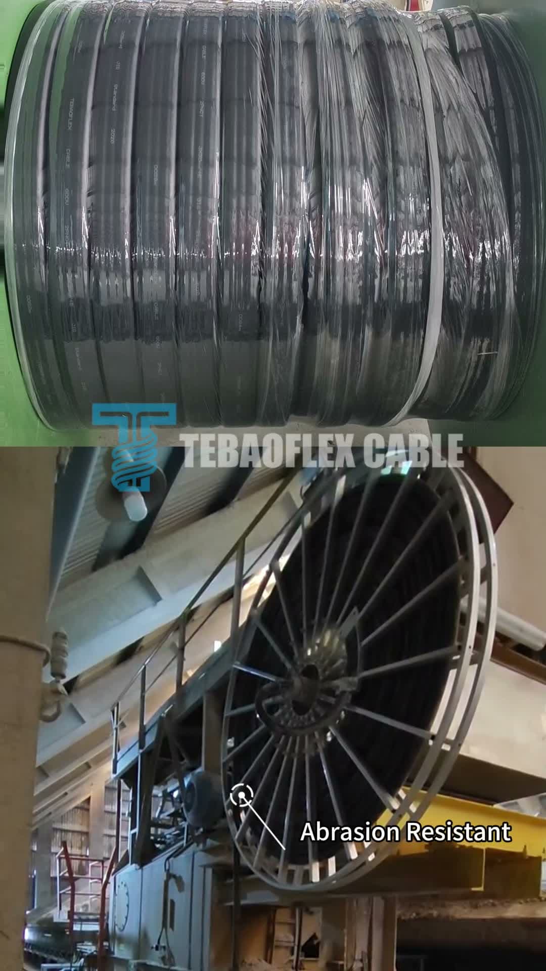 Tightly wound reel of black cable with printed jacket markings, staged on a factory spool
