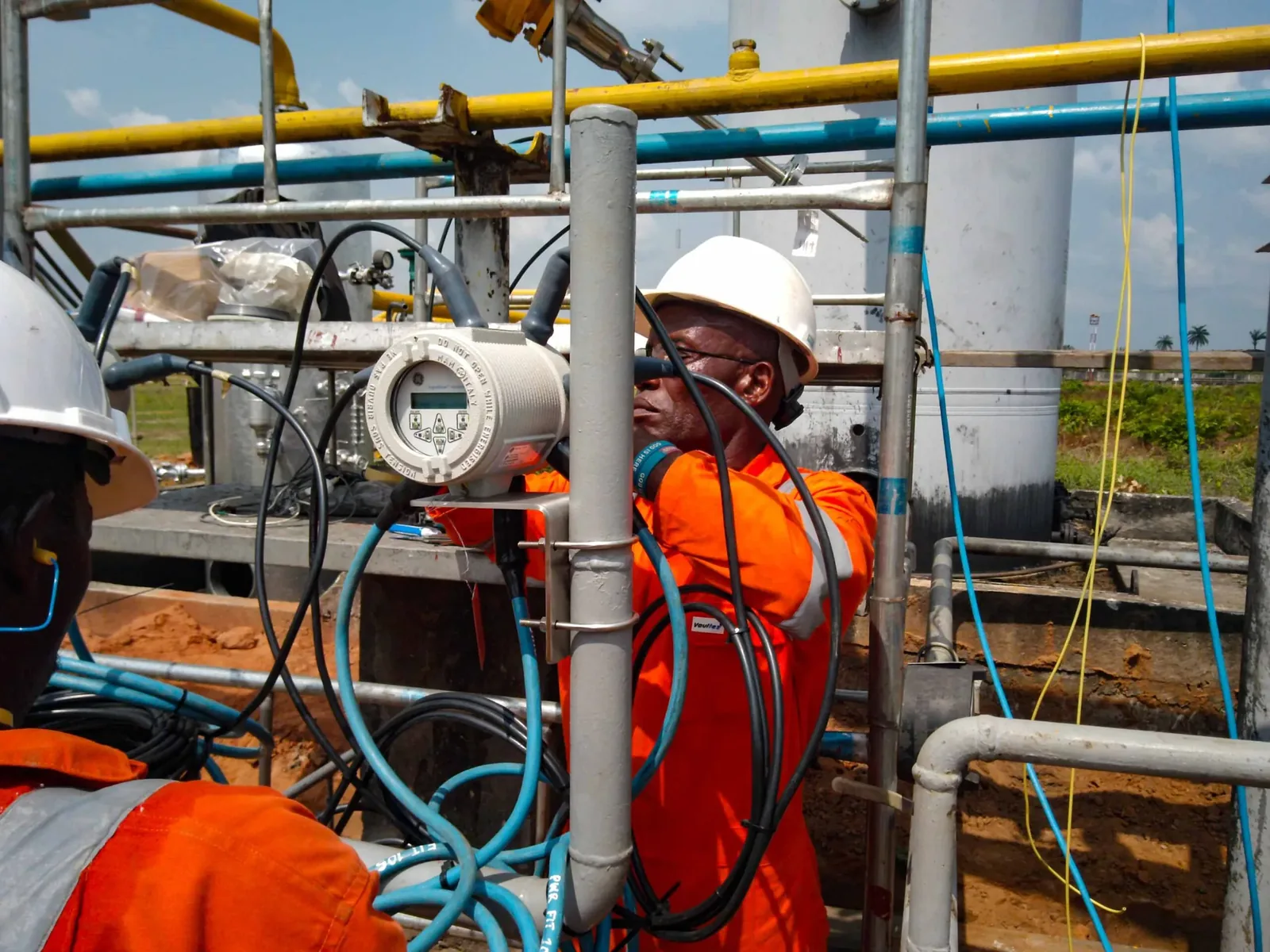 Illustrative technician reviewing an industrial control and instrumentation system